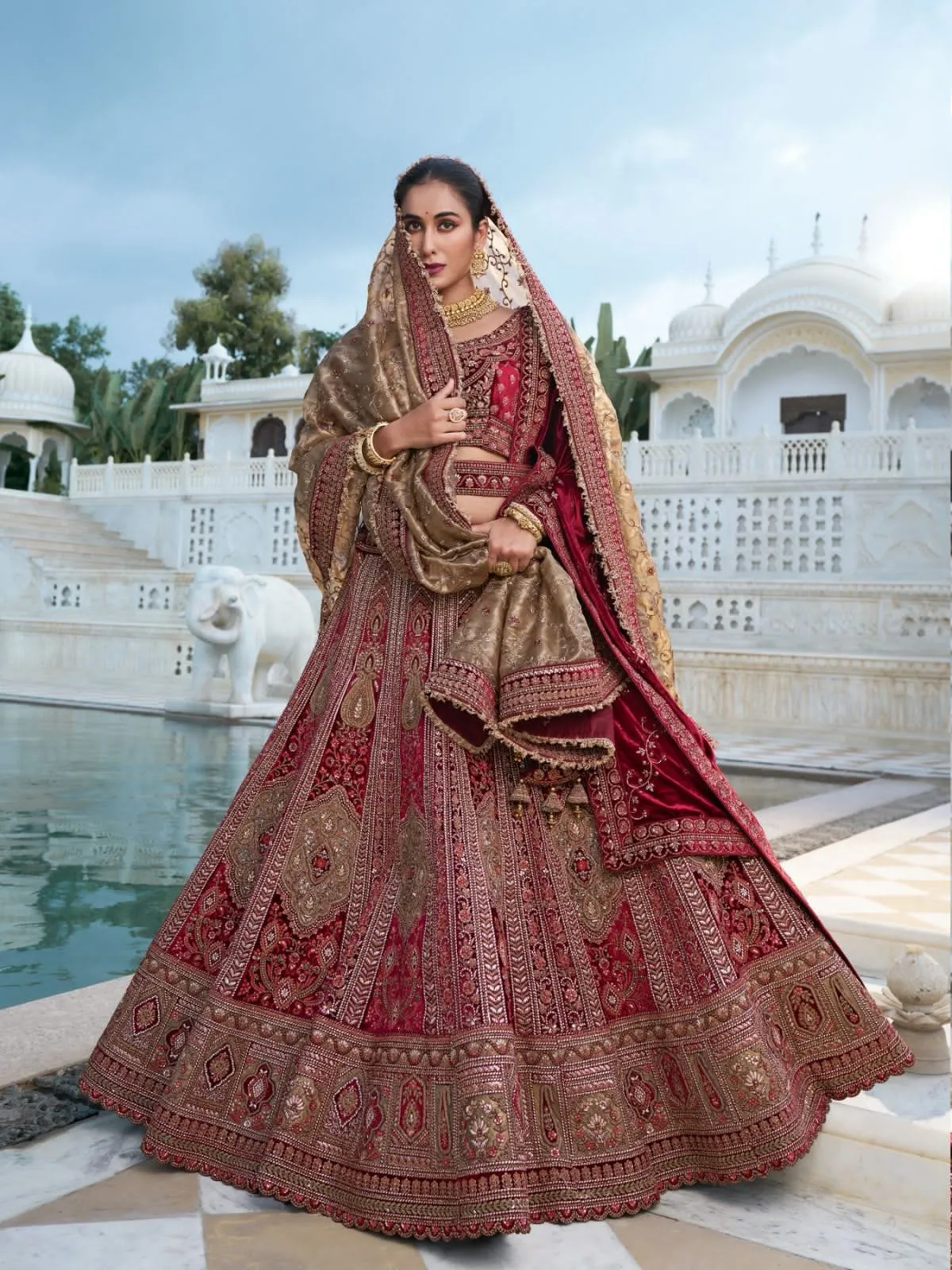 Luxurious Maroon and Gold Bridal Lehenga with Intricate Handcrafted Embroidery